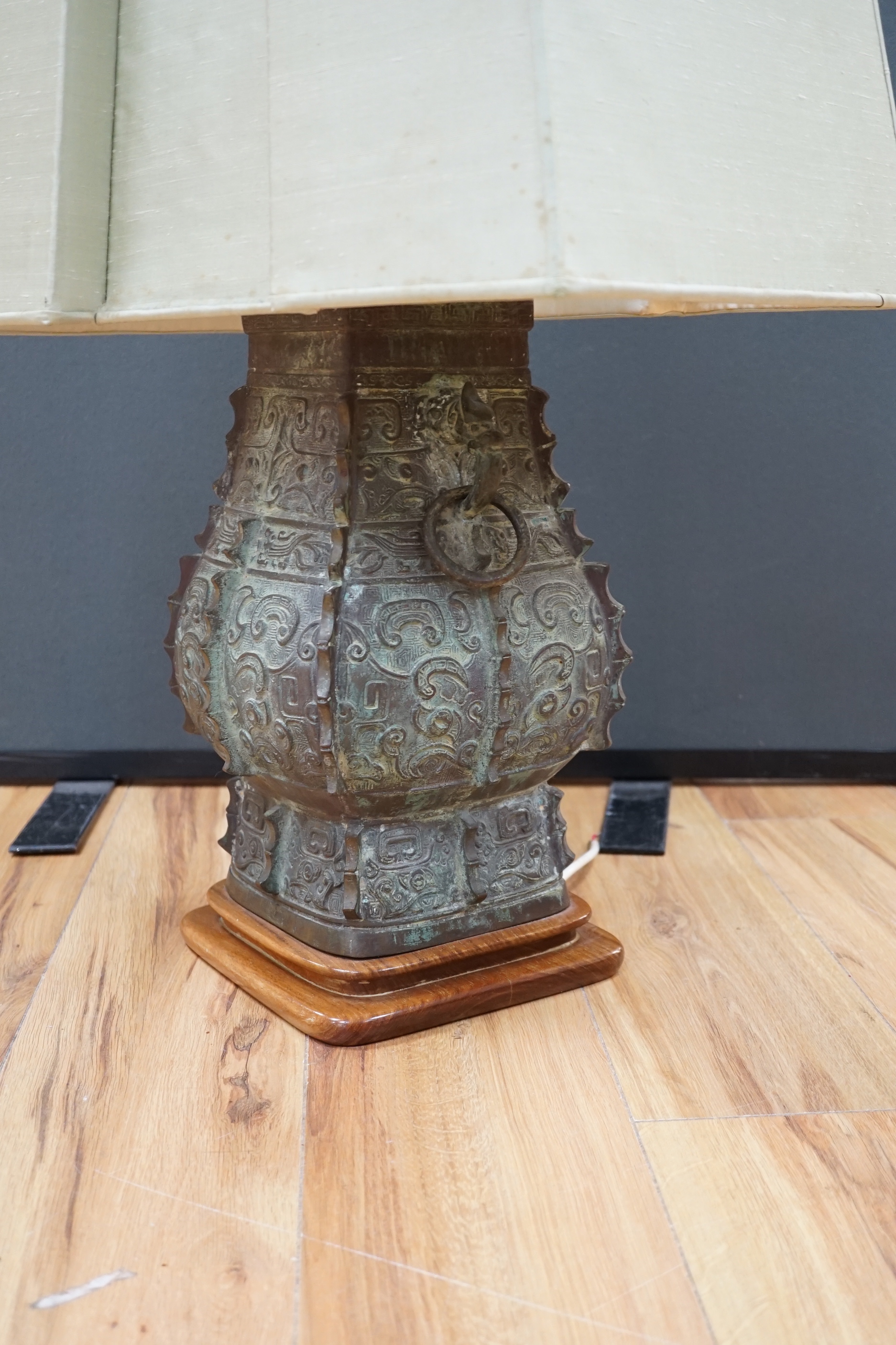 A Chinese archaistic bronze ‘zun’ lamp base, 84cm high including shade